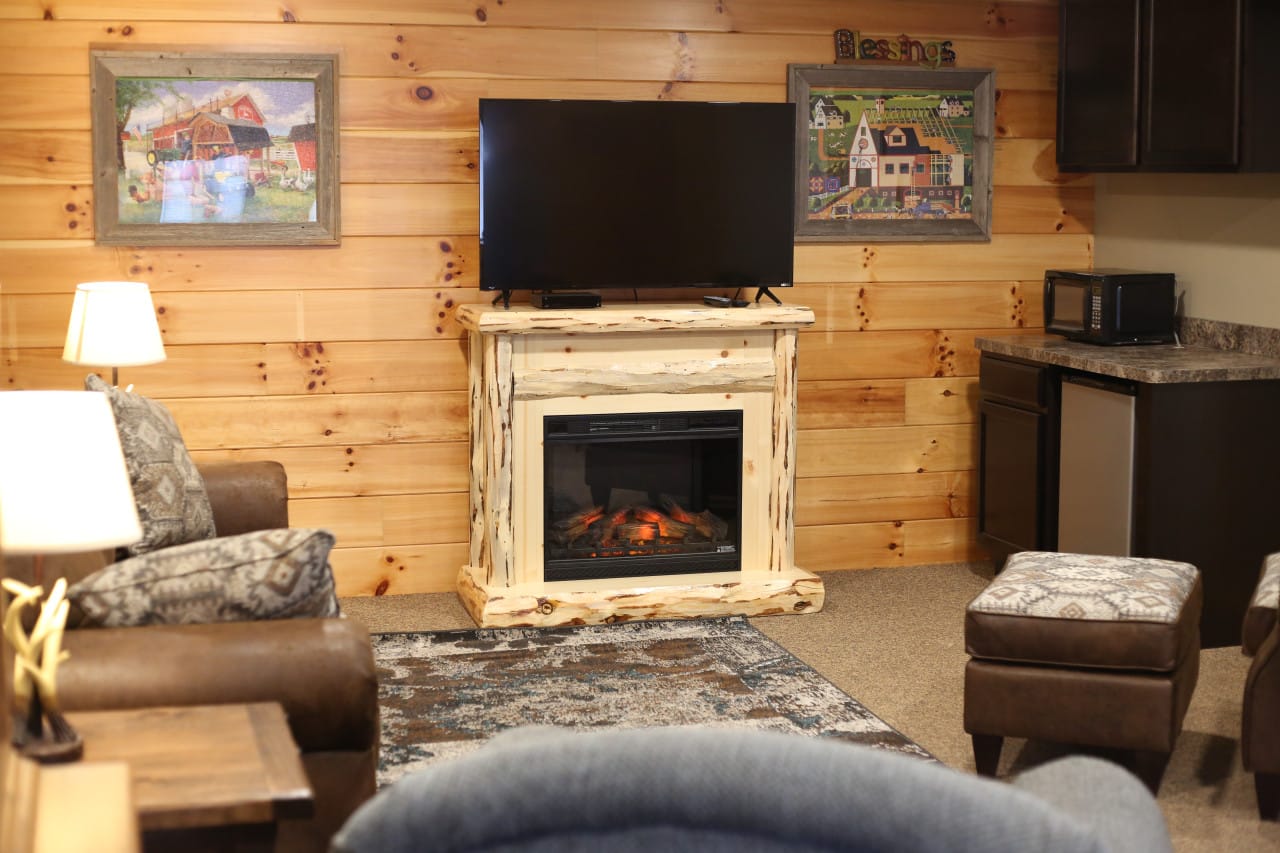 The living room of the Harmony Suite with handcrafted furniture at Blessings Lodge