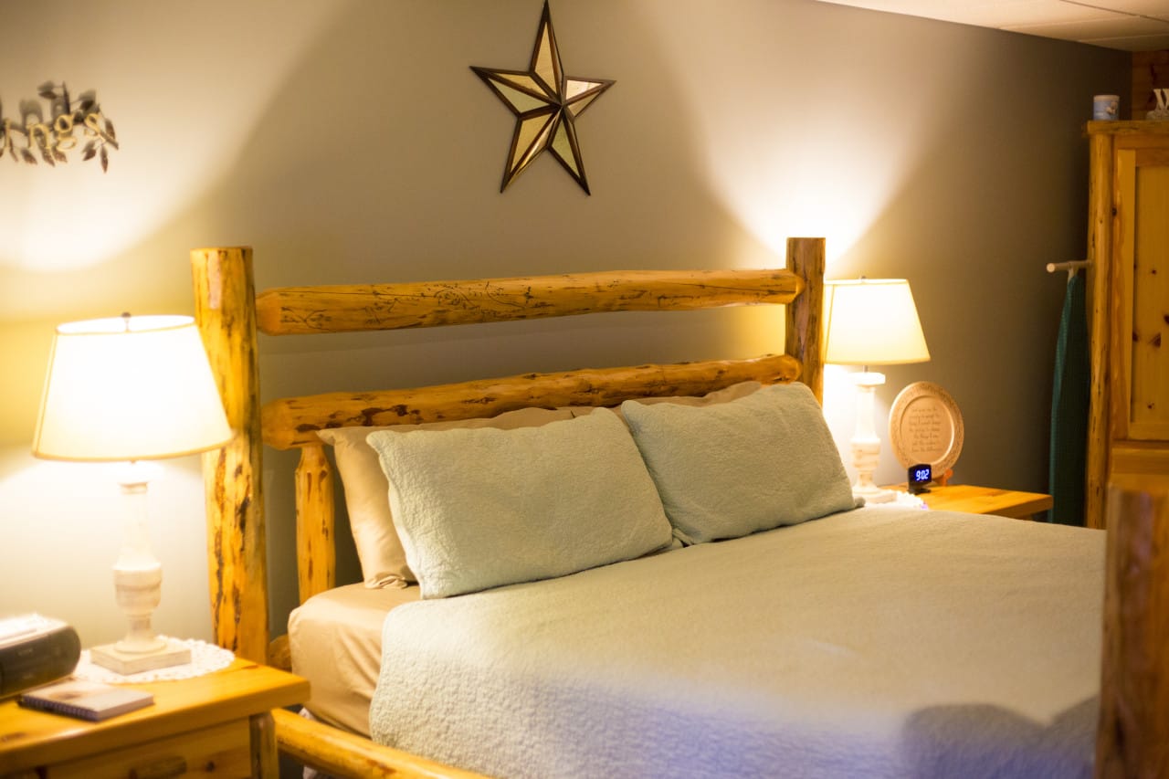 King bed in the Serenity Suite at Blessings Lodge
